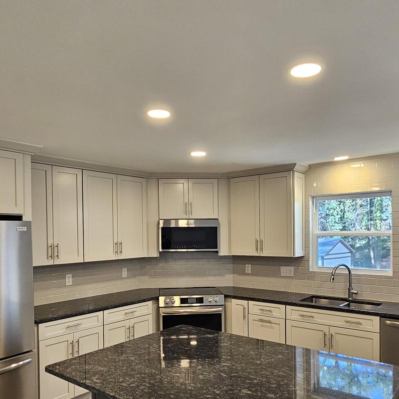 Granite kitchen countertops with cabinetry and appliances Granite kitchen countertops with cabinetry and appliances