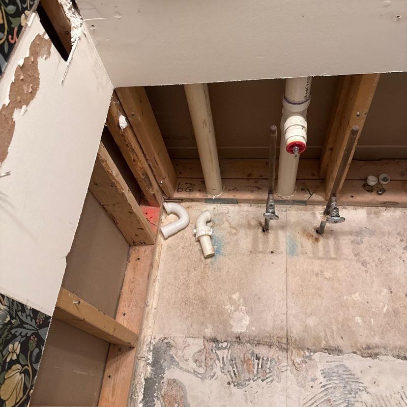 PVC drain pipes and plumbing installation in wall cavity