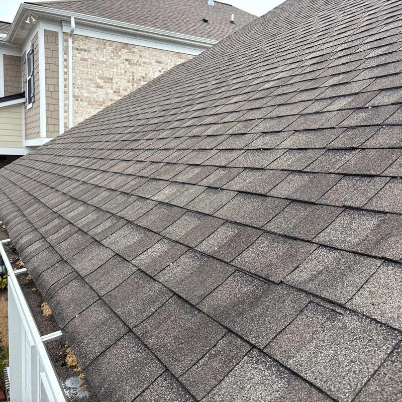 Asphalt shingle roof with hail damage inspection