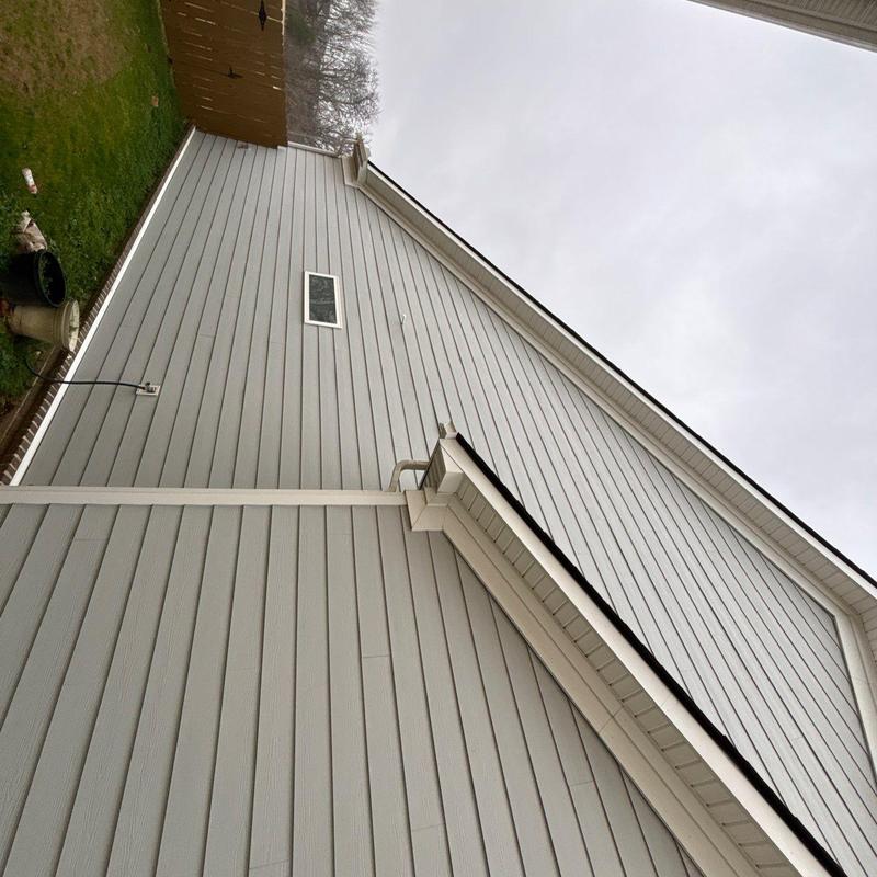 Roof shingles and flashing systems on house exterior