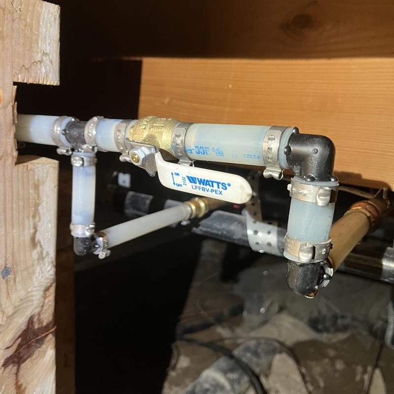 PEX water piping with ball valve in crawlspace