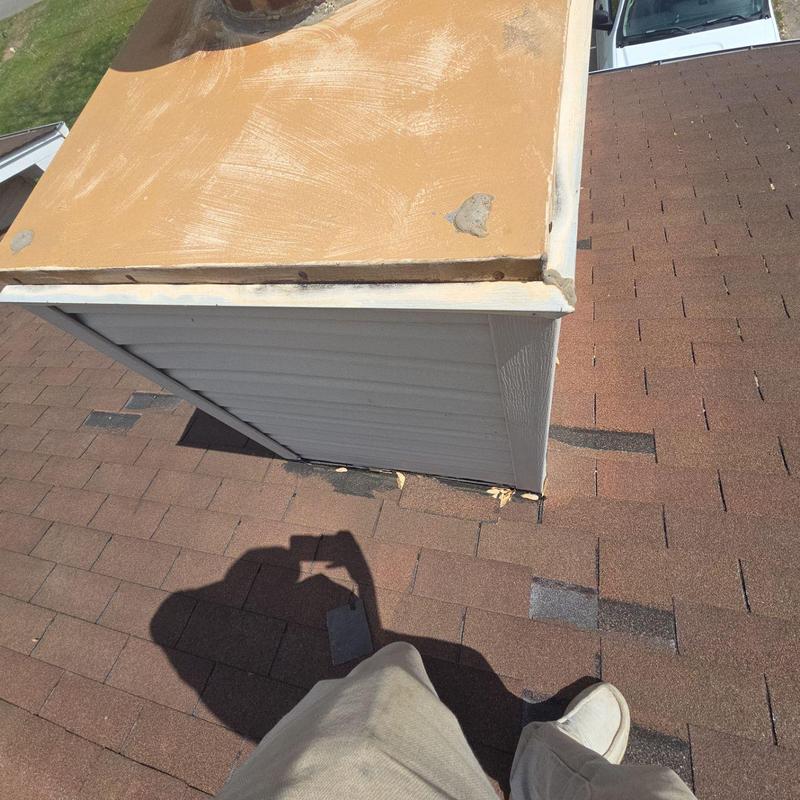 Chimney flashing with visible gaps and sealant aging Chimney flashing with visible gaps and sealant aging