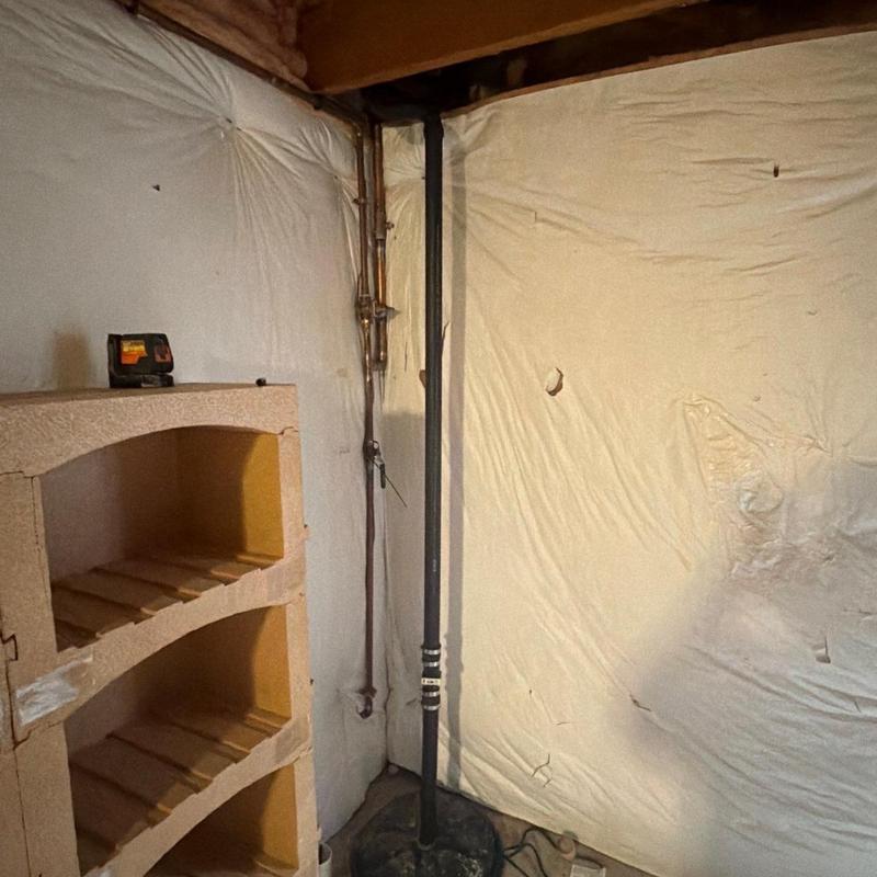 Sump pump discharge pipe installation in basement corner Sump pump discharge pipe installation in basement corner