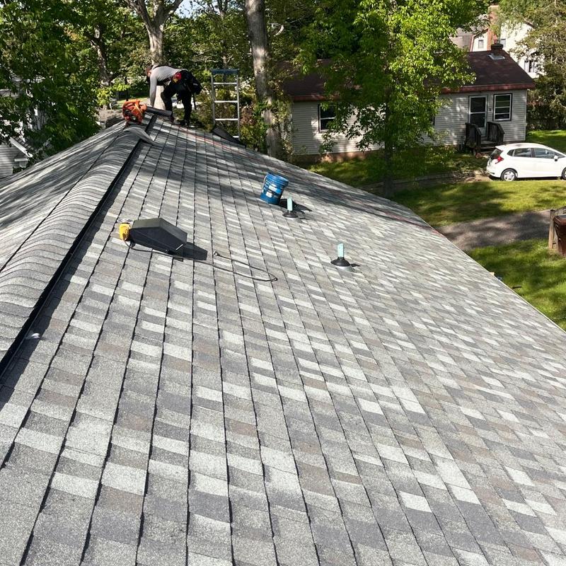 Asphalt shingle roof installation on house roof Asphalt shingle roof installation on house roof