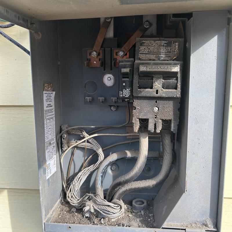 Main service panel with wiring and breakers in Nampa, ID