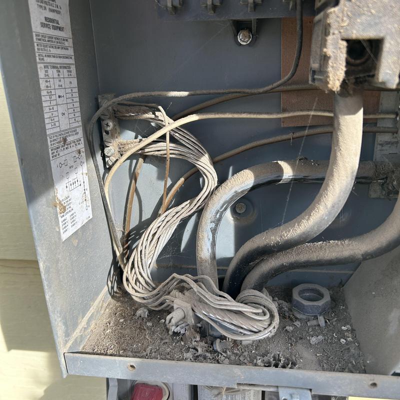 Electrical panel wiring with dust and debris buildup