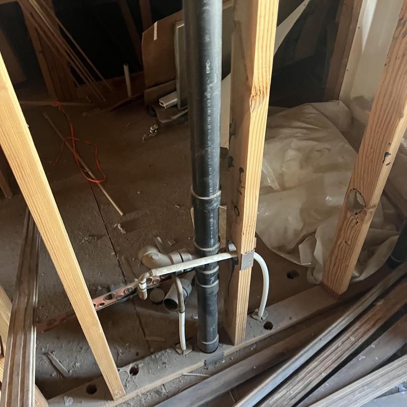 PVC drain pipe with plumbing rough-in in wall framing PVC drain pipe with plumbing rough-in in wall framing
