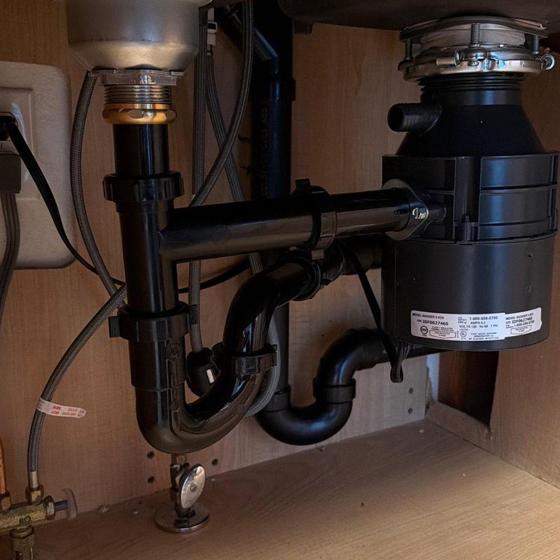 Garbage disposal and drain lines reconfigured under sink