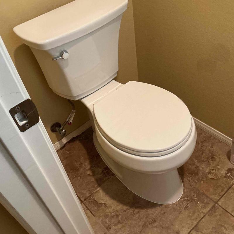 Toilet installation with new wax ring and supply line