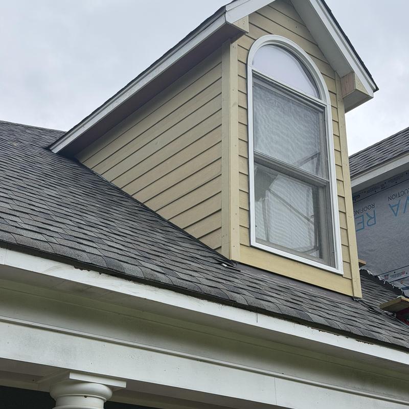 Dormer siding installation on house front in Brandon MS