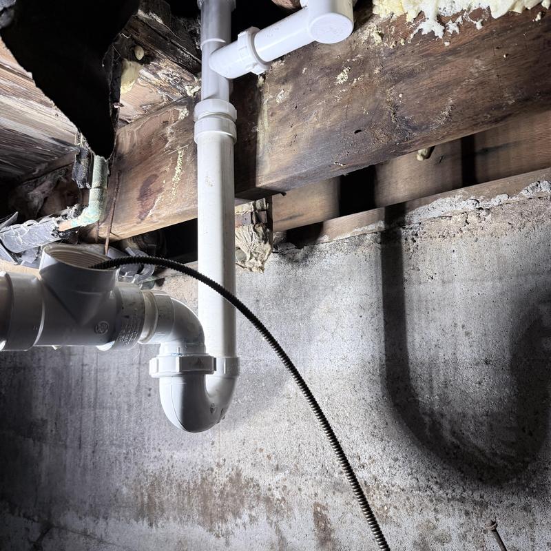 Tub drain PVC piping with new upsized replacement