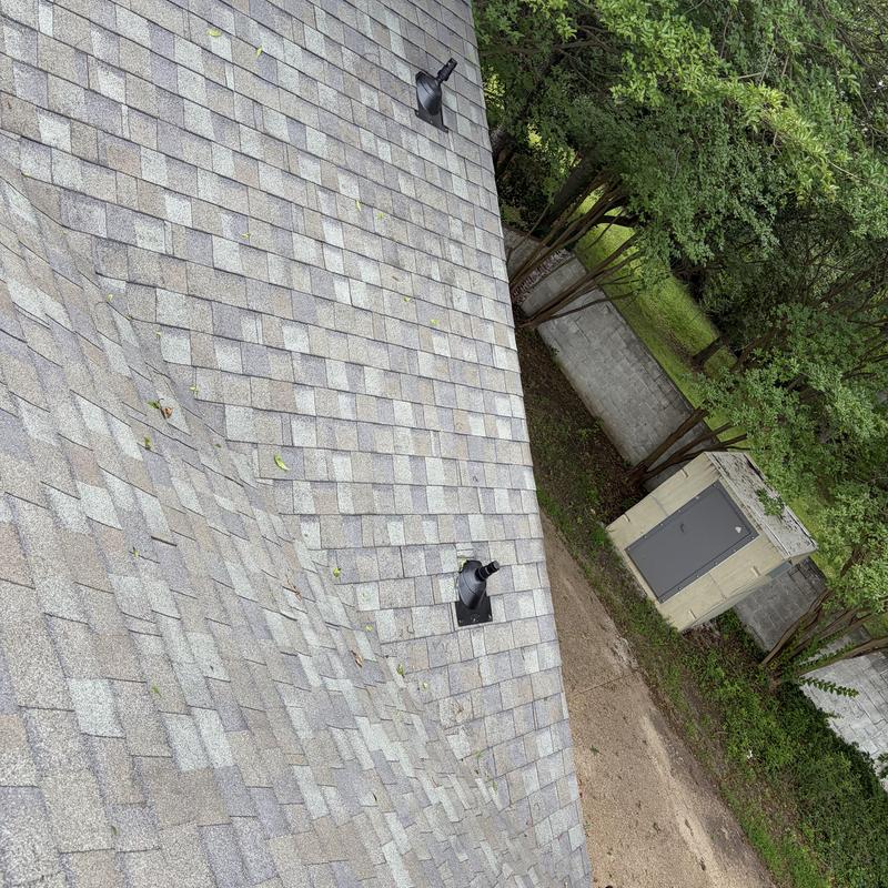 Pipe boots and vent caps on asphalt shingle roof