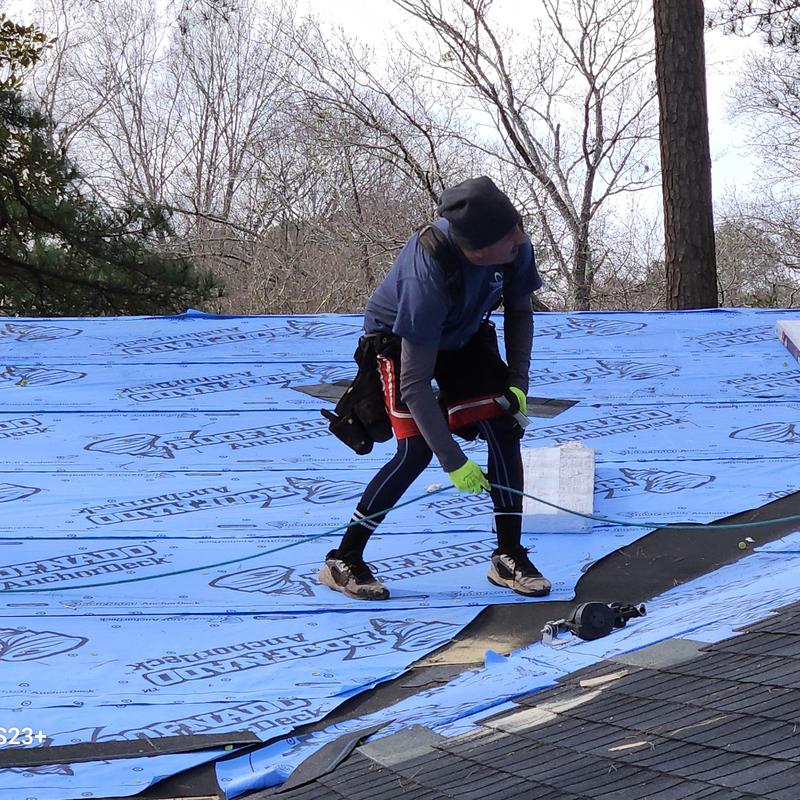 Roof underlayment installation on residential roof Roof underlayment installation on residential roof
