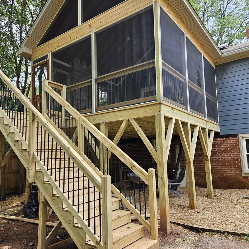 Screened deck addition with wooden stairs and railing Screened deck addition with wooden stairs and railing
