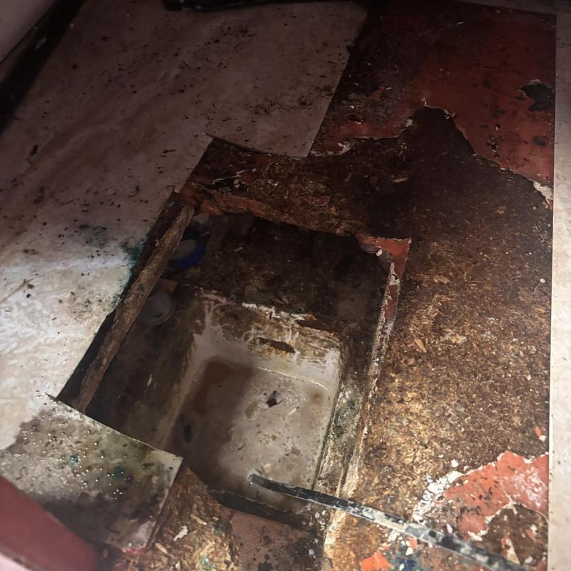 Floor drain cavity with damaged surrounding flooring