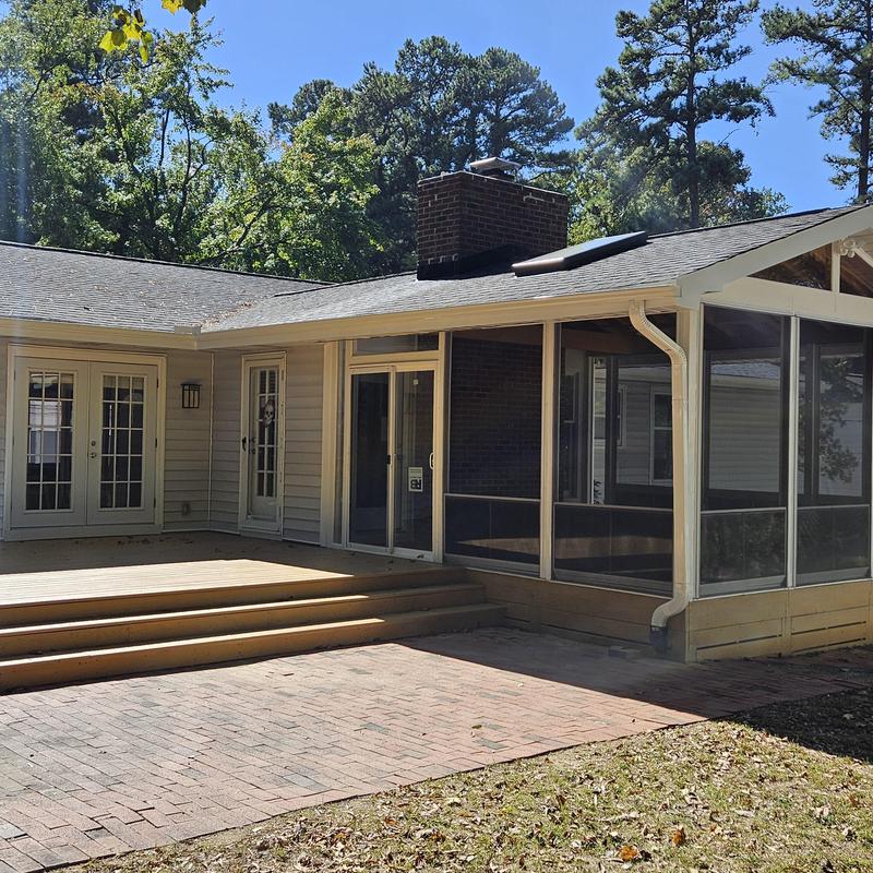 Screened porch addition with brick patio and deck steps Screened porch addition with brick patio and deck steps