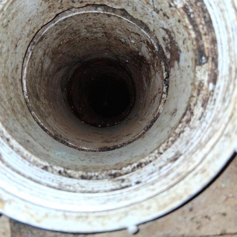 Main drain pipe interior showing root intrusion removal