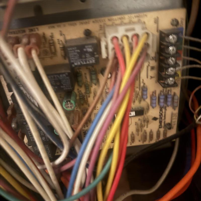 HVAC control board with multicolored wiring connections HVAC control board with multicolored wiring connections