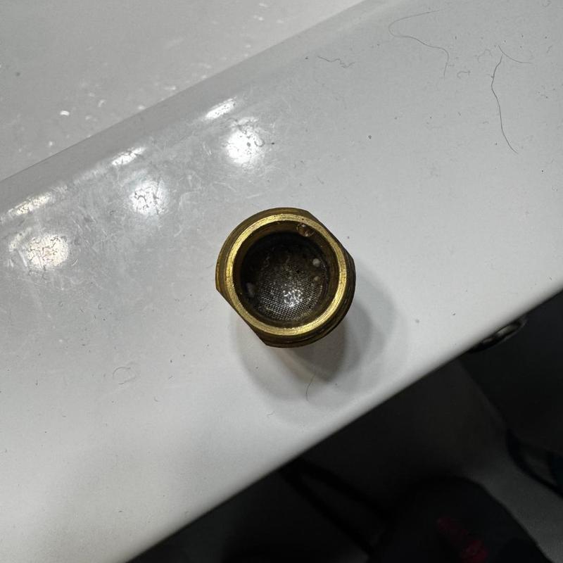 Faucet screen filter with debris removed in Waterford