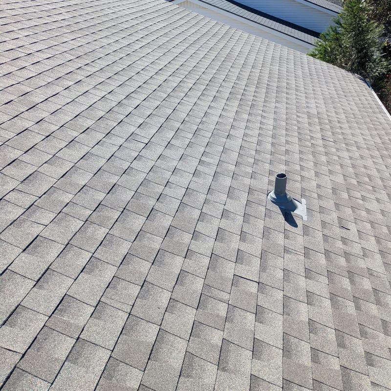 Asphalt shingle roof with vent pipe installed Asphalt shingle roof with vent pipe installed