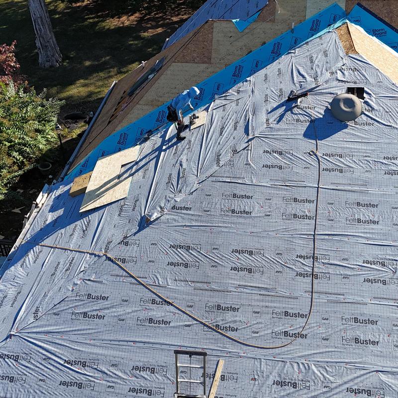 Roof underlayment installation on steep residential roof Roof underlayment installation on steep residential roof
