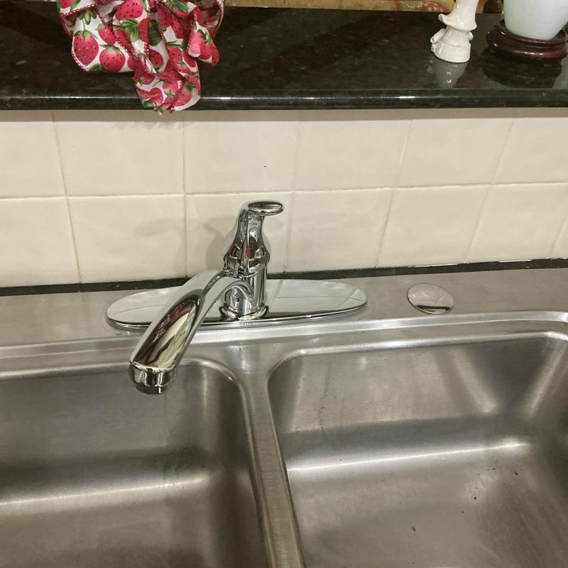 Single handle kitchen faucet with cover plate installed