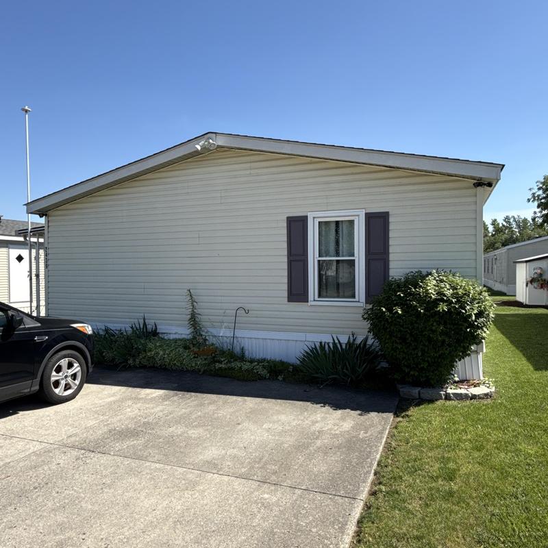 Skylight and roof inspection on mobile home exterior