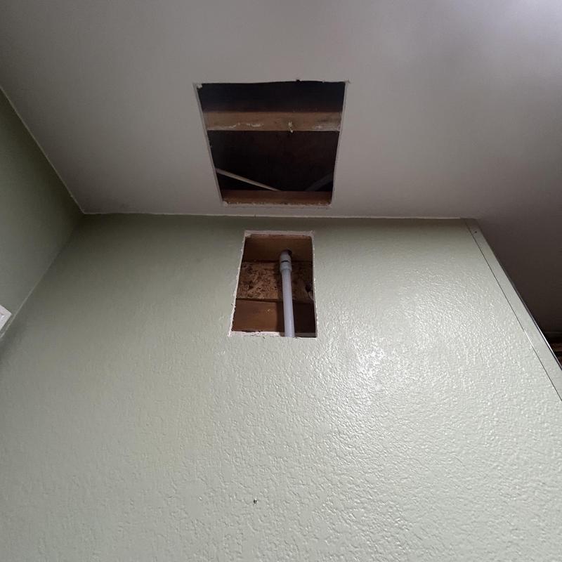 Hot water line reroute inside wall and ceiling cutouts