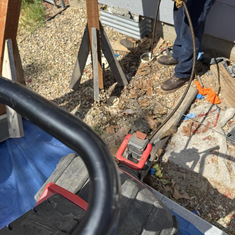 Sewer cleanout and jetting with plumbing technician