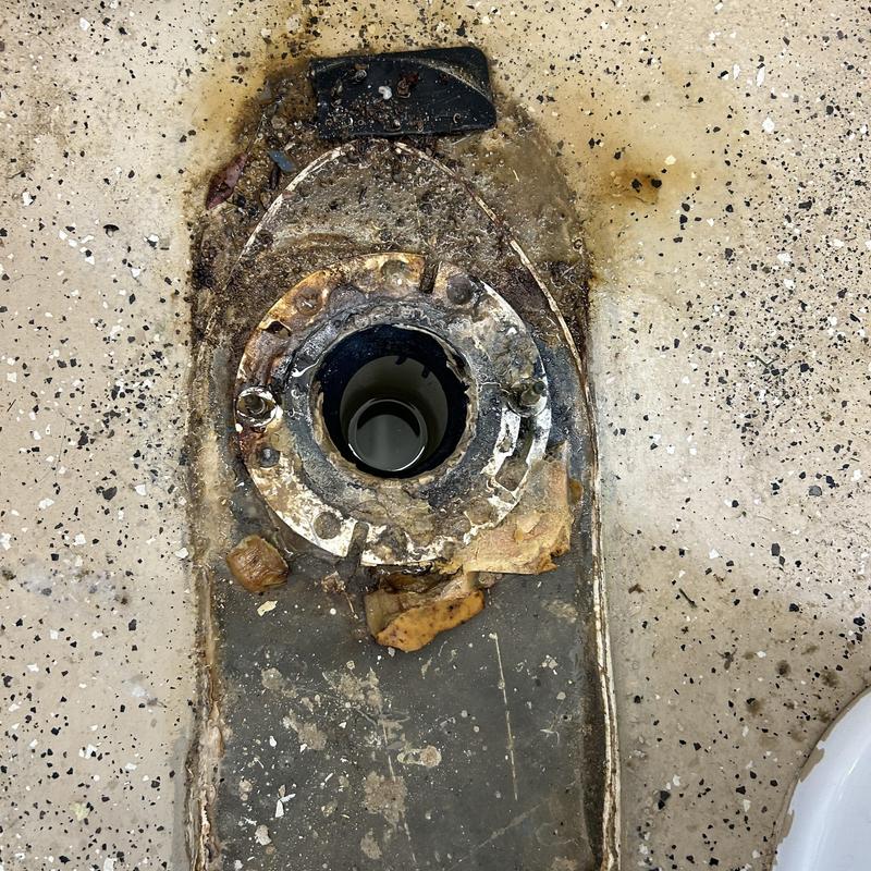 Toilet flange with corrosion and residue buildup