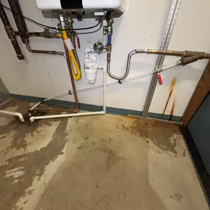 Tankless water heater drain valve and piping installation