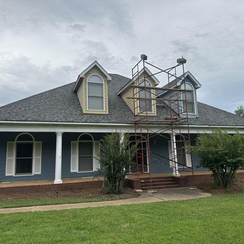 Roof dormer scaffolding setup on residential house