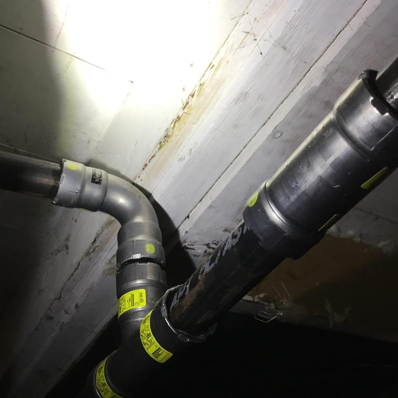 Natural gas line with elbow fitting under ceiling