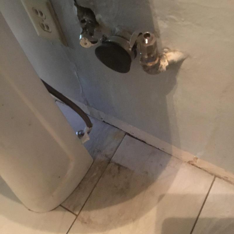 Pedestal sink drain piping disconnected from wall