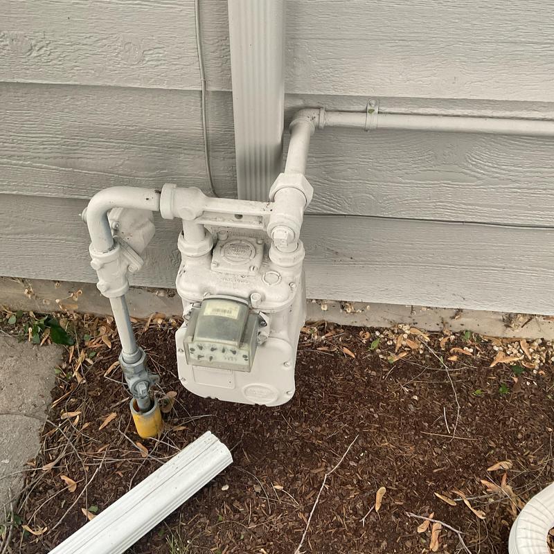Gas meter and line installation estimate on house exterior