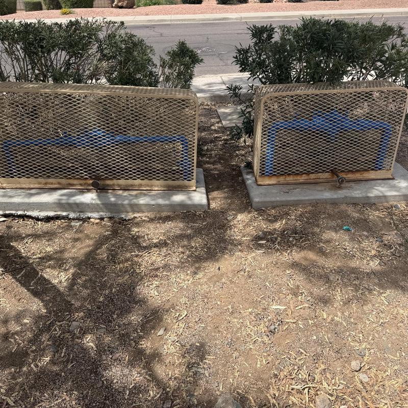 Water meter boxes with protective metal covers outdoors