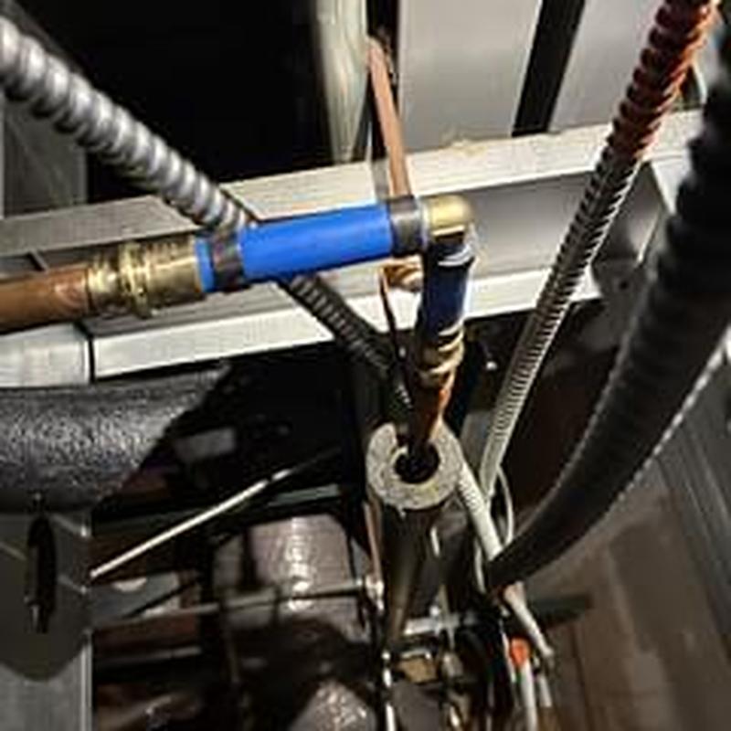 Cold water line with plumbing connections in ceiling