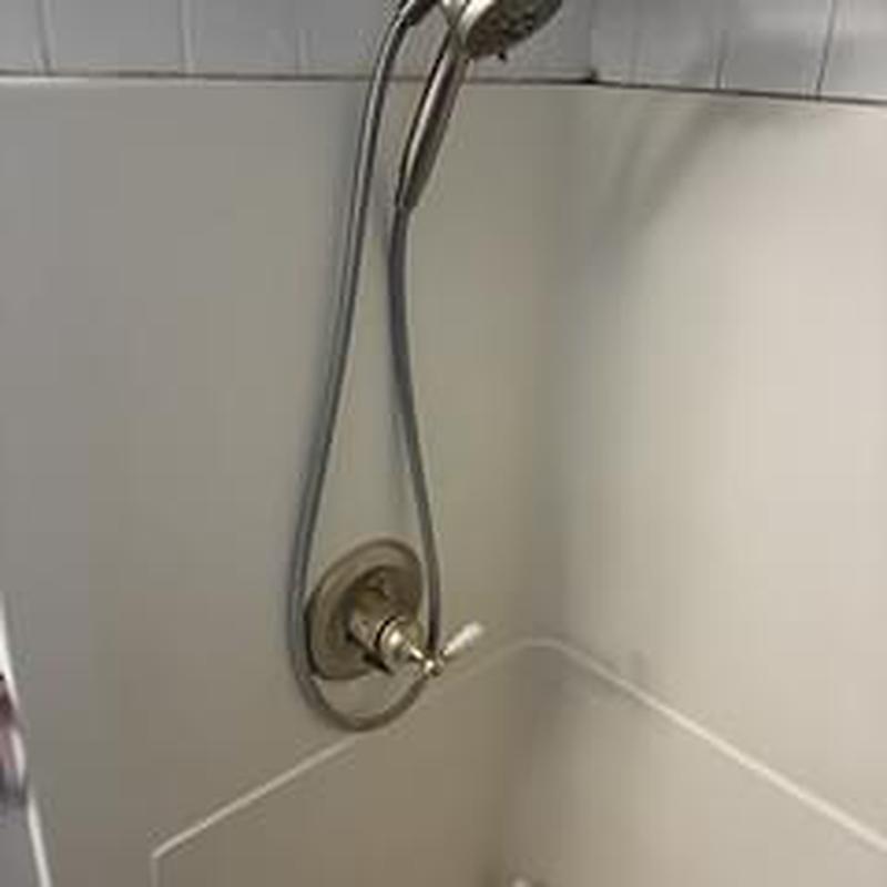 Tub shower faucet with handheld showerhead in tub area