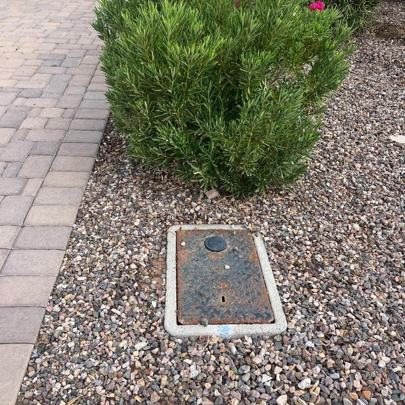 Main waterline valve box in landscaped gravel bed Main waterline valve box in landscaped gravel bed