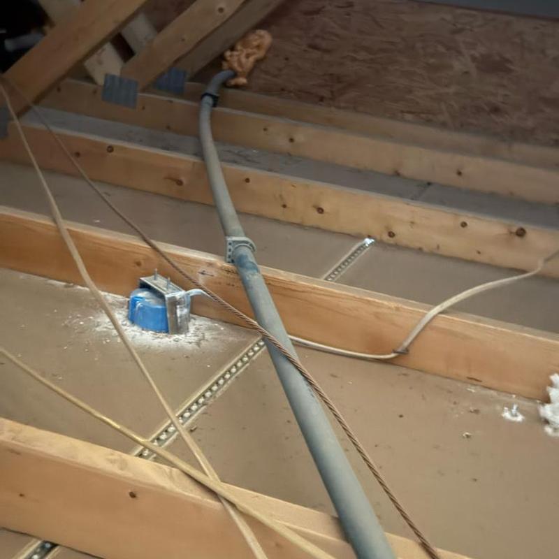 Main waterline piping strapped in attic above garage Main waterline piping strapped in attic above garage