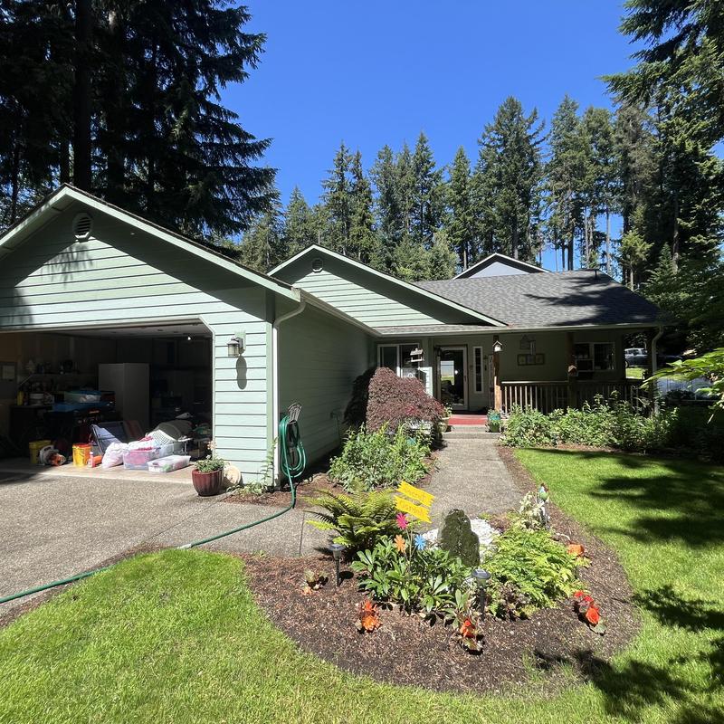 Asphalt shingle roof on woodland home in Hayden, ID Asphalt shingle roof on woodland home in Hayden, ID