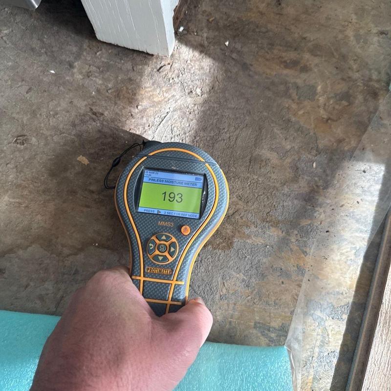 Moisture meter detecting floor slab humidity levels