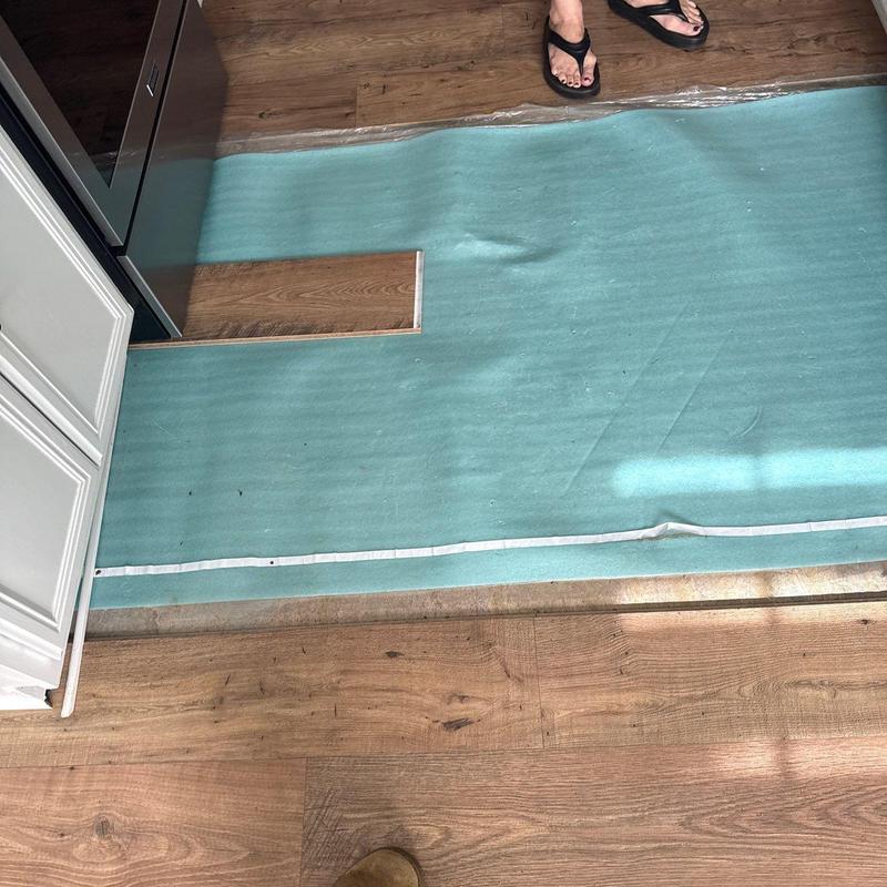 Laminate flooring installation with underlayment padding