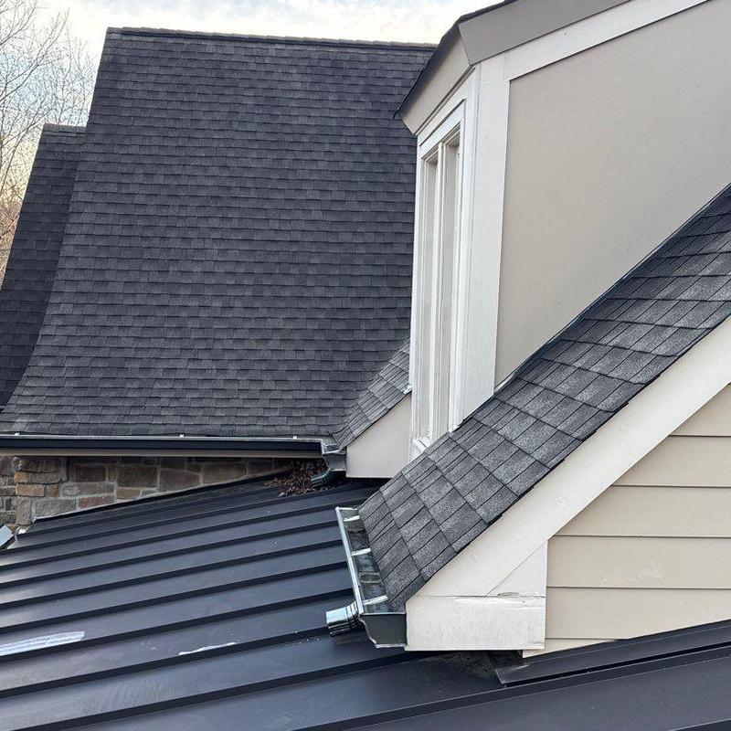Shingles and roof flashing inspection on residential roof