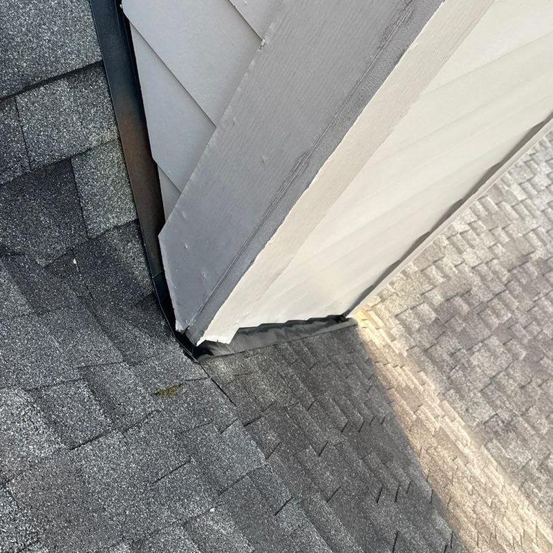 Roof flashing at siding junction with shingle roof