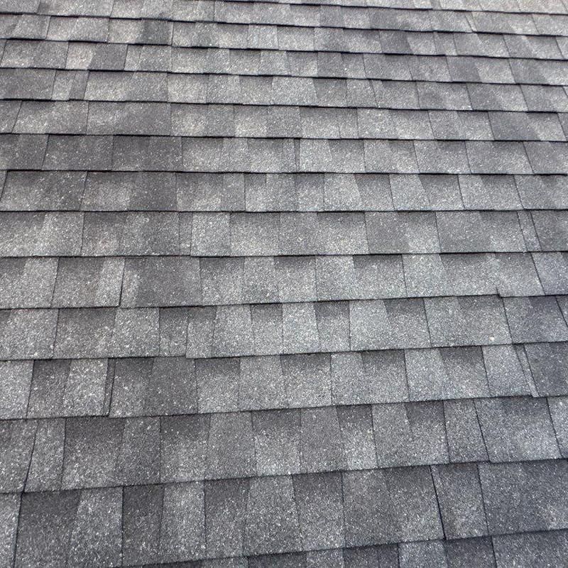 Asphalt shingles with hail damage on residential roof