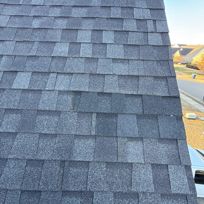 Asphalt shingles with hail damage on residential roof