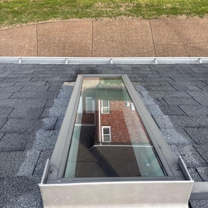 Skylight flashing and shingle hail damage on roof