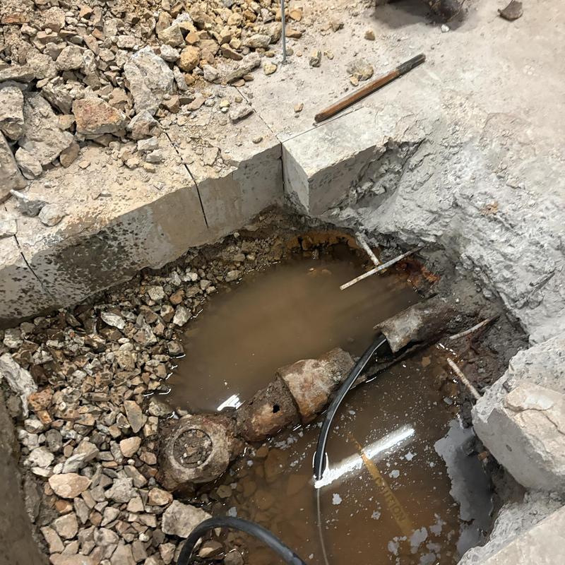 Main sewer line with camera inspection snake in trench Main sewer line with camera inspection snake in trench