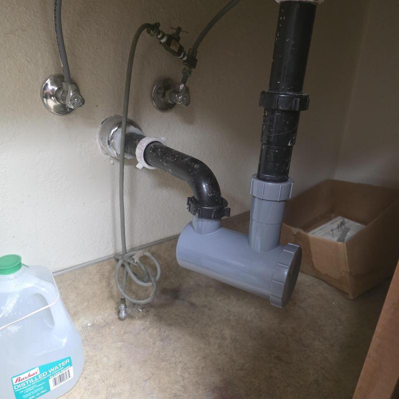 Hair trap installation on veterinary office sink drain Hair trap installation on veterinary office sink drain